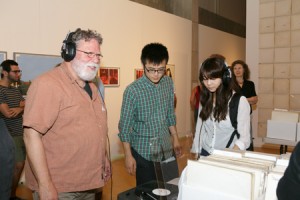 Visitors to Zilkha Gallery enjoy the "We Buy White Albums" installation by Rutherford Chang '02 during the Opening Reception for "The Alumni Show II" on September 10, 2013. Photo by Sandy Aldieri. 